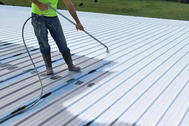 homeguide-contractor-coating-and-sealing-a-metal-roof