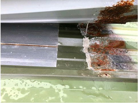 Water getting into laps of metal roof
